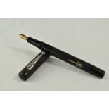 A Conway Stewart 479 lever fill fountain pen in black with engine turned decoration having Conway