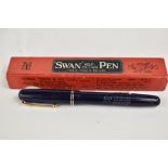 A boxed Mabie Todd & Co Swan lever fill 3220 fountain pen in blue with two narrow bands to the cap