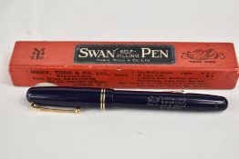 A boxed Mabie Todd & Co Swan lever fill 3220 fountain pen in blue with two narrow bands to the cap