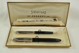 A Sheaffer Sentinel Snorkel fountain pen and propelling pencil set in black with chrome cap and