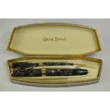 A boxed Conway Stewart 27 lever fill fountain pen and propelling pencil set in silver grey hatch