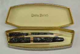 A boxed Conway Stewart 27 lever fill fountain pen and propelling pencil set in silver grey hatch