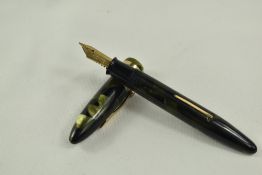 A Sheaffer Balance Snr lever fill fountain pen in green/black marble with single band and white spot