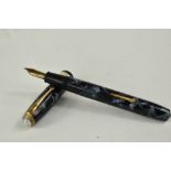 A Conway Stewart 27 lever fill fountain pen in blue black marble with single broad band to the cap