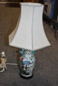 An early 20th century Chinese porcelain lamp base or vase decorated with cats