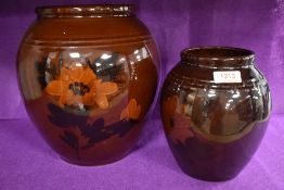 Two antique vase both having deep brown glaze with hand painted scenes of flowers