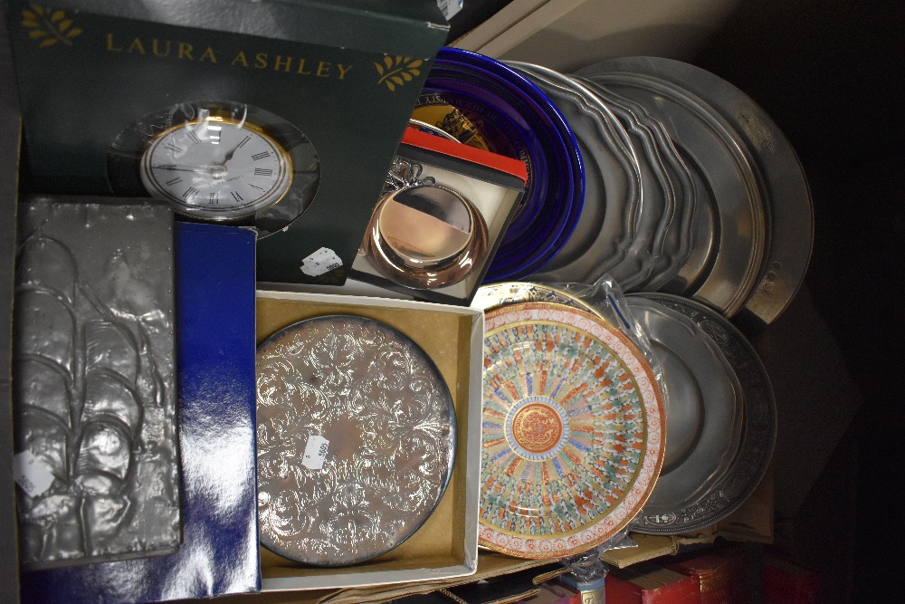 A box containing commemorative ware, Laura Ashley wall clock, silver plated taste de vin, Arts and