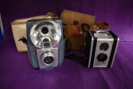 A Kodak Duaflex reflex camera and a Kodak Brownie Flash 20 camera