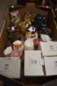 A box containing a selection of ornamental owls including money boxes, salt pig style containers and