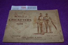 An early 20th century Players cigarette card album of Cricketers with a signed receipt from C.