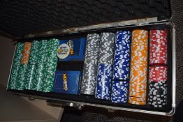 A cased set of Game On poker chips and cards
