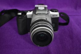 A Pentax MZ-30 with SMC Pentax-FA 1:4-5,6 35-80mm lens