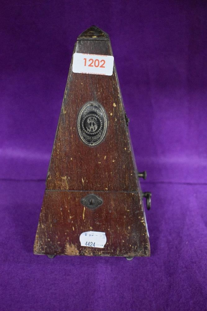 An early 20th century System Maezel Metronome in wooden case.