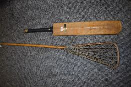 A 20th century La Crosse stick and a Gray Nicolls Steel Spring cricket bat