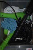 An electric floor steamer with accessories.