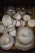 A selection of Royal Albert dinner ware having white ground with black motif and gilt detailing,