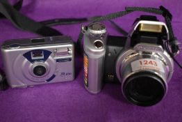 A Konika Minolta Dimage Z2 digital camera in original box and a Jenoptix JD350 camera