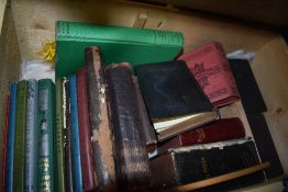 A vintage painted pine box with a selection of religious interest books.