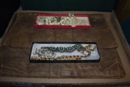 A selection of modern costume jewellery including necklaces and vintage Pyjama case