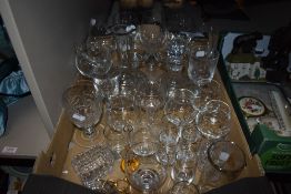 A collection of decanters and drinking glasses.