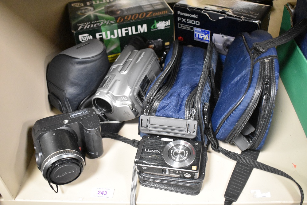 A selection of modern digital cameras including Fujifilm Fine Pix 6900, Lumix DMC FX500 and Sony