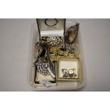 A small selection of ladies costume jewellery including yellow and white metal chains and