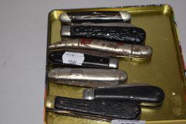 Seven pocket or pen knives including metal, horn and carved wood handles