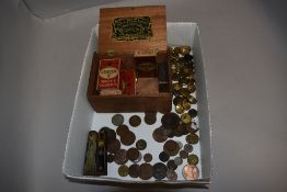 A selection of collectable coins and currency including some early cigarette packets