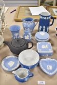 A selection of Wedgwood Jasper wares including lidded dishes and vase, also a Basalt teapot having