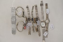 Ten ladies watches having silver tone straps.