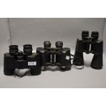 Three pairs of binoculars including USSR 12x40, Hilkinson 8x40 and Regent 12x50