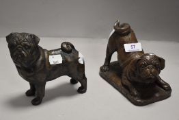 Two modern pug dog figures in a bronze effect resin cast