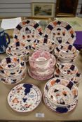 A selection of tea cups and saucers with cake plates in Gaudy Welsh and Sunderland lustre patterns