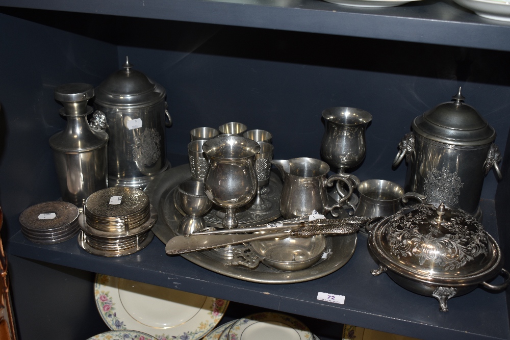 A selection of silver plated serving wares including muffin dish, serving tray, goblets and a pair