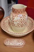 An early 20th century Mintons wash stand set having red pattern on cream ground, Af.