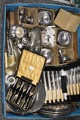 A fine selection of silver plated table wares including cased cutlery, sundae dishes and place mats