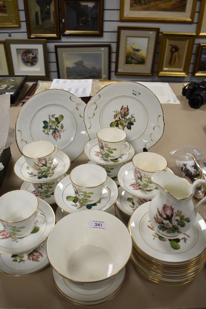 A Victorian porcelain part tea service having floral print pattern with enamel detailing