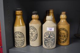 Seven early 20th century stone ware advertising bottles of local interest including Morecambe,