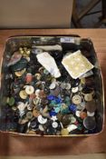 A tin full of assorted dress makers and haberdashery buttons