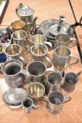 A good selection of pewter wares including tankards, dishes plates and tea pot