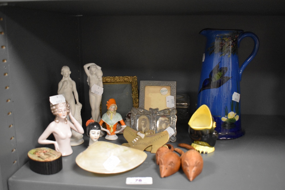 A selection of decorations including a pair of parian ware figures, Torquay ware water jug and small