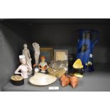 A selection of decorations including a pair of parian ware figures, Torquay ware water jug and small
