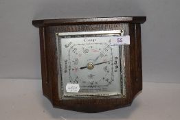 An Edwardian Smiths Shortland barometer having oak case with metal dial