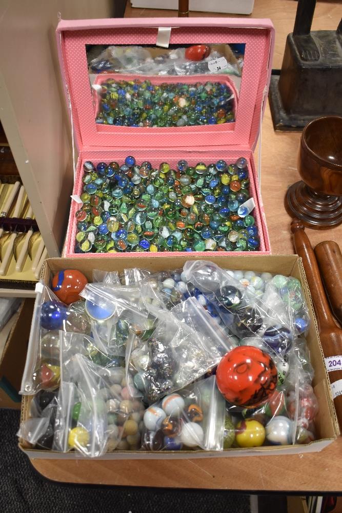Two boxes of marbles including large king marbles, swirls and cats eyes