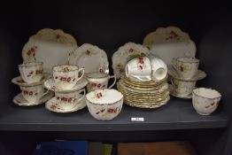 An early 20th century Wellington china part tea service having gilt and floral pattern