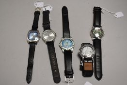 Five mens watches having black straps.