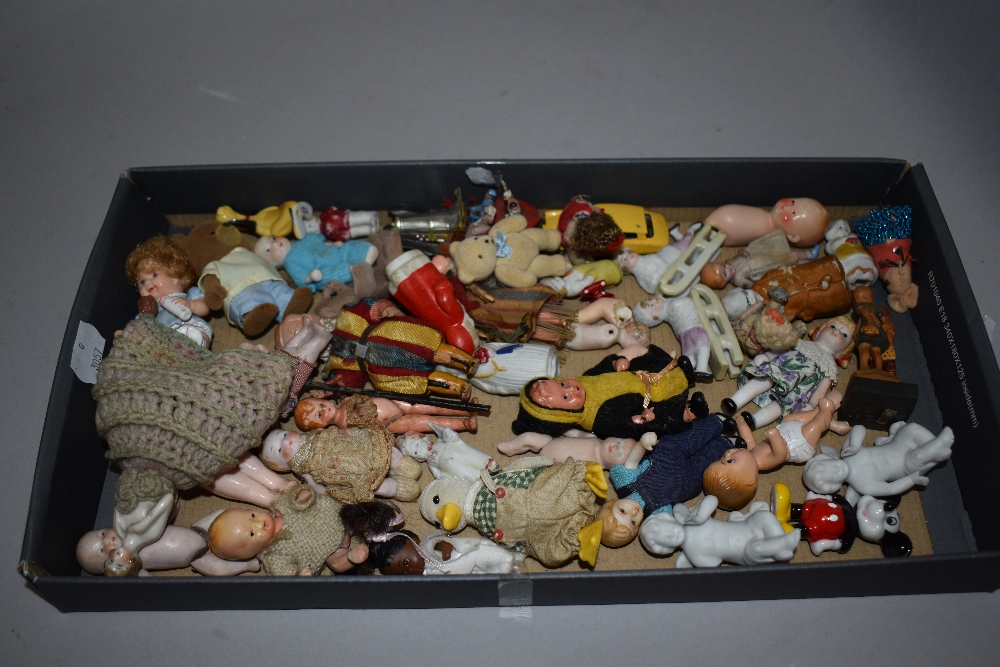 A good collection of early 20th century miniature dolls and toy figures including porcelain,