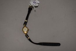 An early 20th century Chalet ladies wristwatch with a yellow metal case