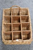 A wicker woven bottle basket for twelve