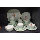 A 20th century Coalport part tea service with embossed and printed floral pattern